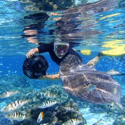 a statue of a person in a pool of water