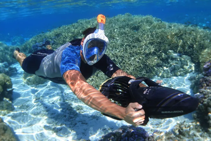a man swimming in a body of water