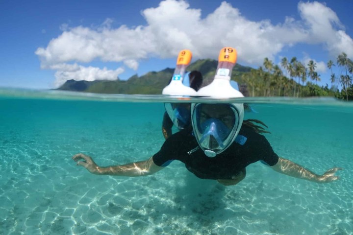 a man swimming in a body of water