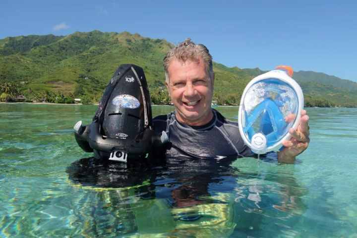 a man swimming in a body of water