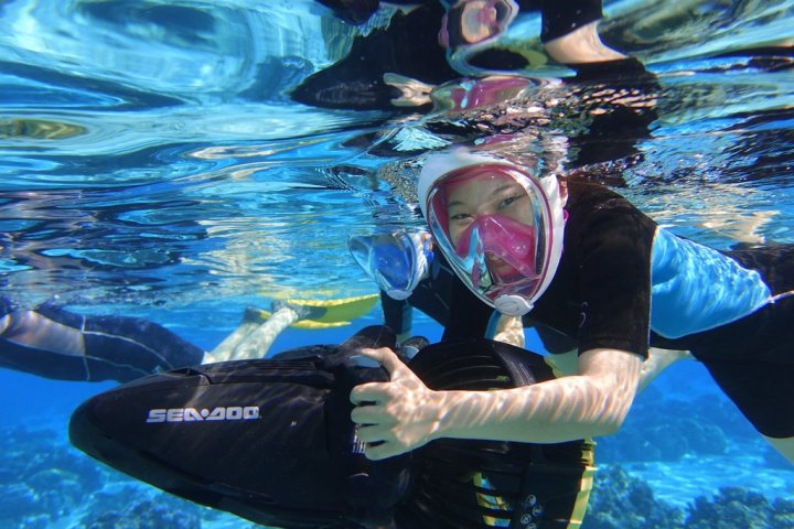 a person swimming in a pool of water